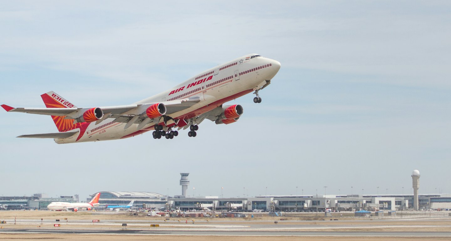 Air India Boeing 747 jet taking off from the runway.
